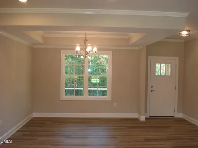 a bathroom with a granite countertop sink and a window