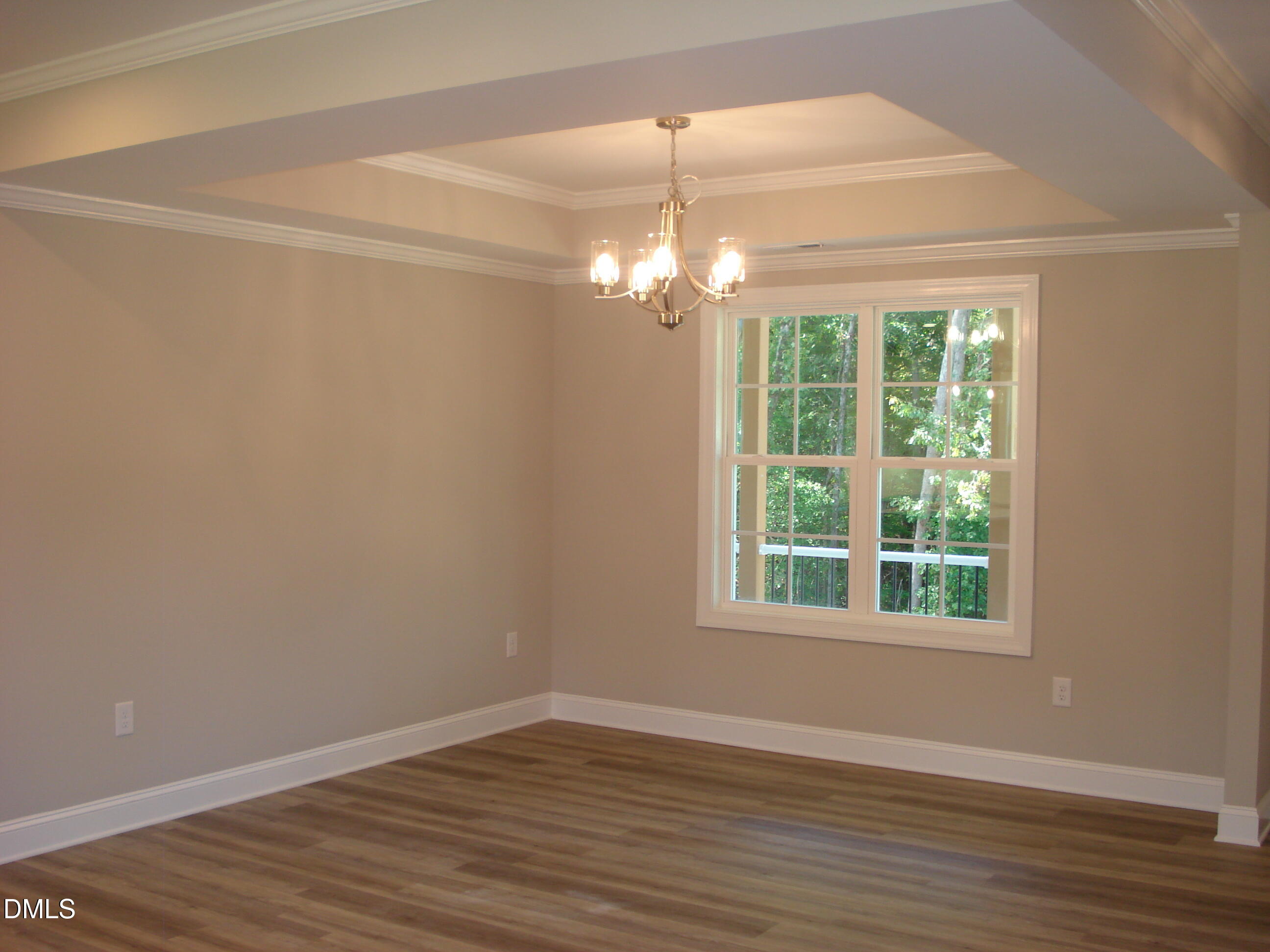 93 Big J Street Erwin, NC 28339 - Photo 21 of 56 a view of an empty room with wooden floor and a window