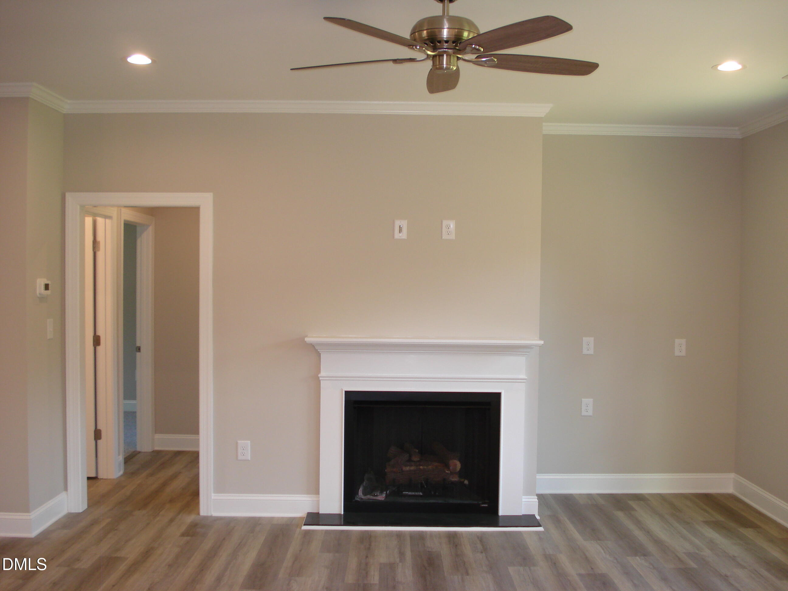 93 Big J Street Erwin, NC 28339 - Photo 22 of 56 a living room with a fireplace and a fireplace