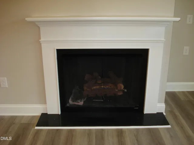 a metallic refrigerator freezer sitting in a kitchen