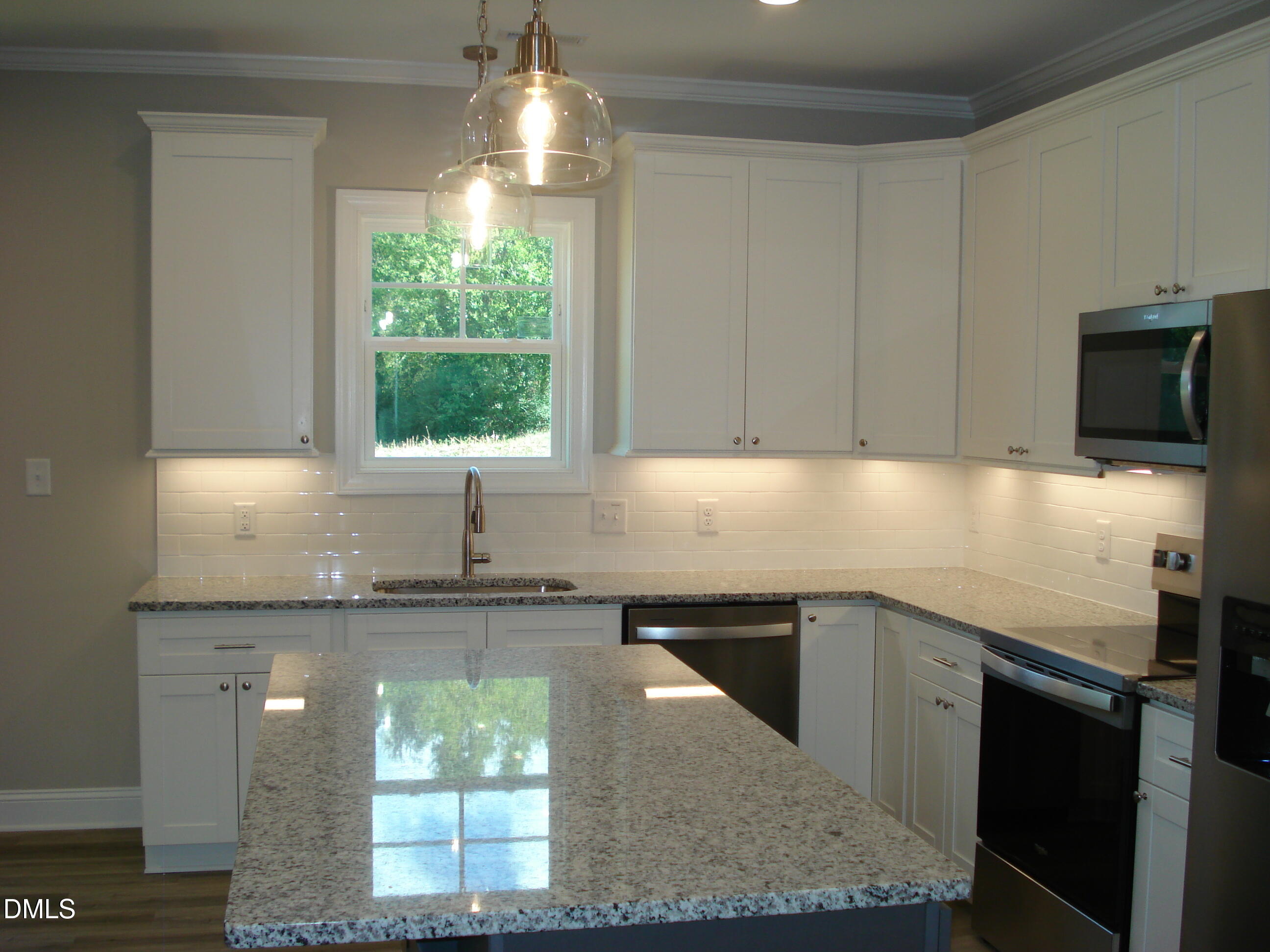 93 Big J Street Erwin, NC 28339 - Photo 26 of 56 a kitchen with stainless steel appliances granite countertop a sink a stove and a microwave