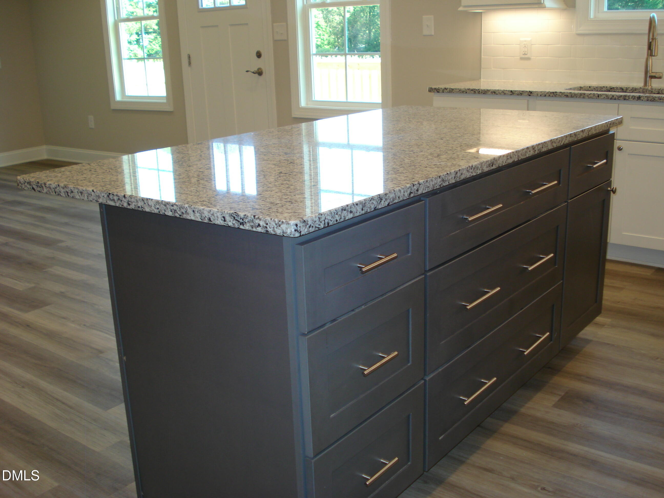 93 Big J Street Erwin, NC 28339 - Photo 27 of 56 a bathroom with a granite countertop sink and a window