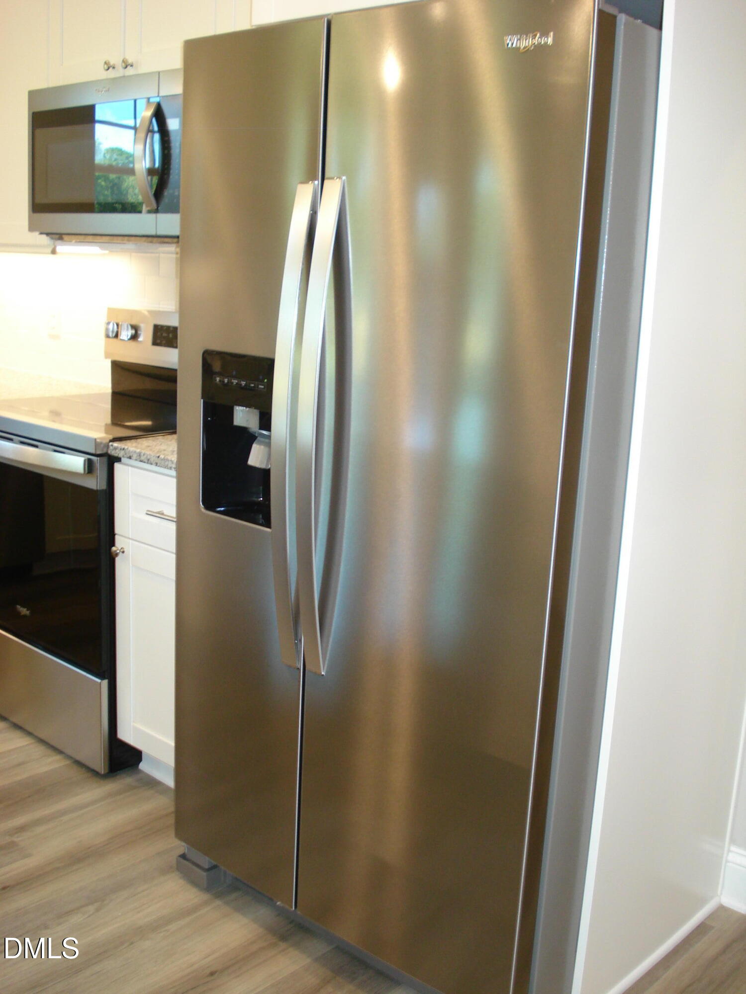 93 Big J Street Erwin, NC 28339 - Photo 30 of 56 a metallic refrigerator freezer sitting in a kitchen