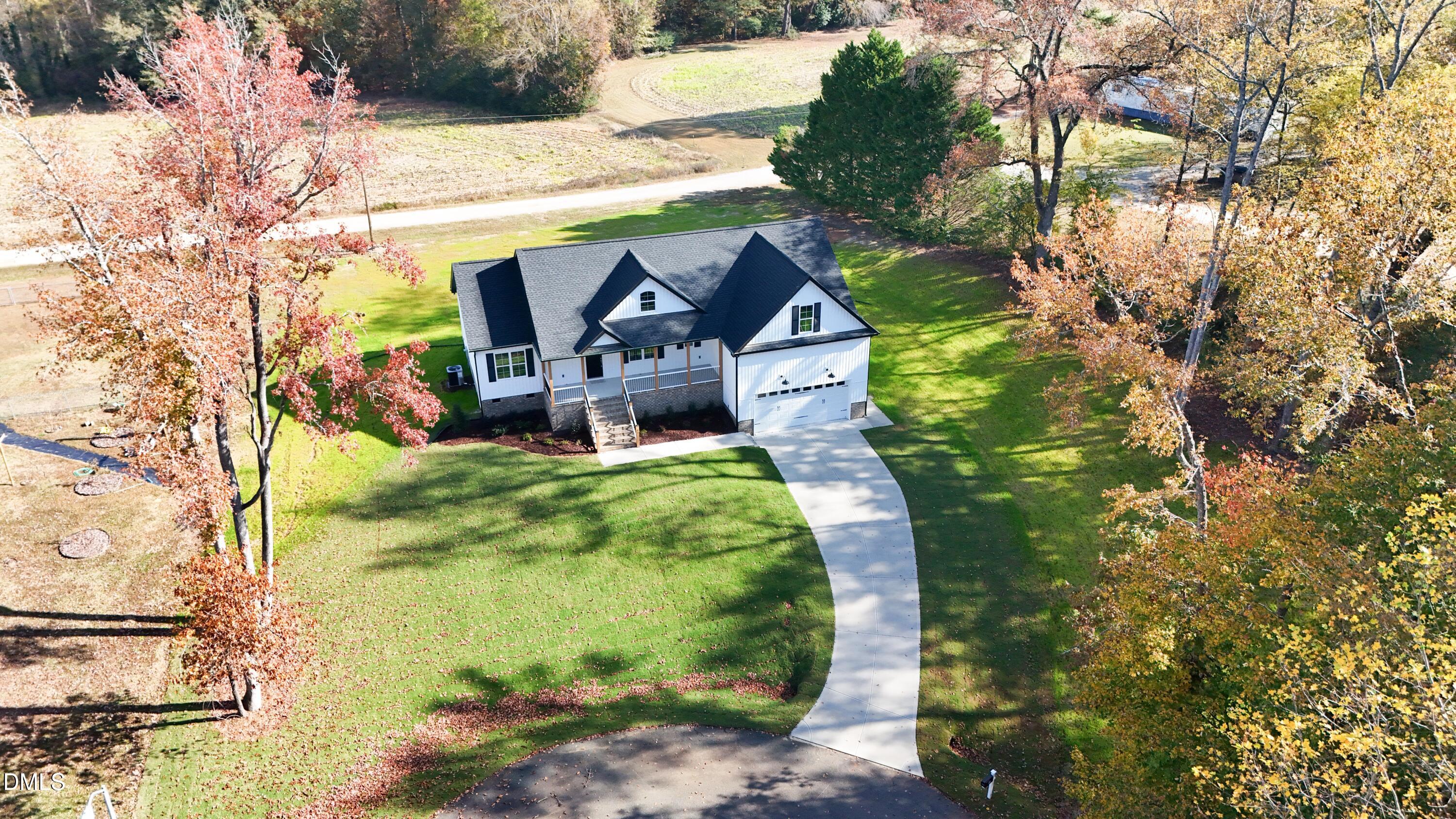 93 Big J Street Erwin, NC 28339 - Photo 4 of 56 a garden view with a seating space