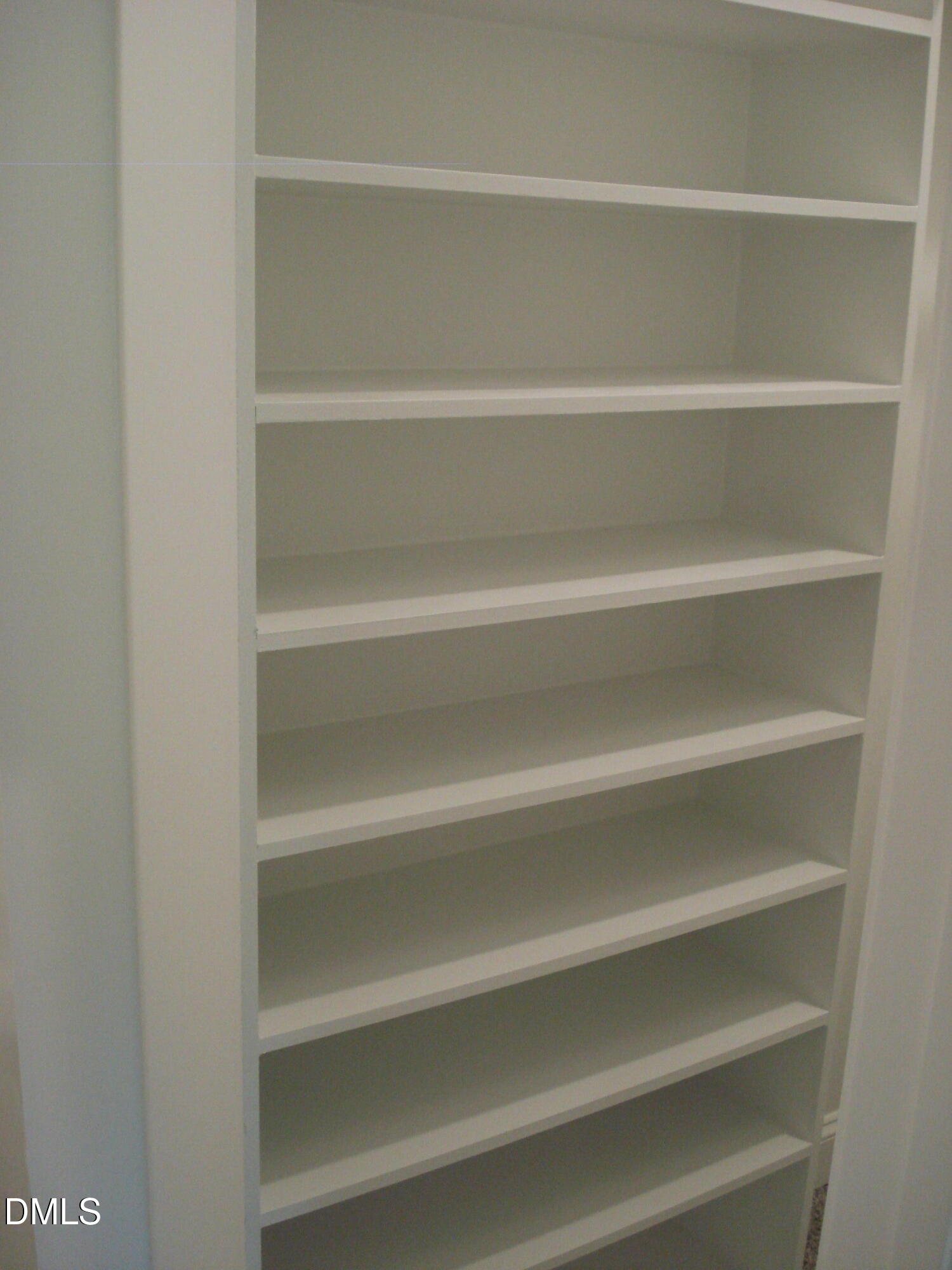 93 Big J Street Erwin, NC 28339 - Photo 43 of 56 a view of walk in closet with empty racks