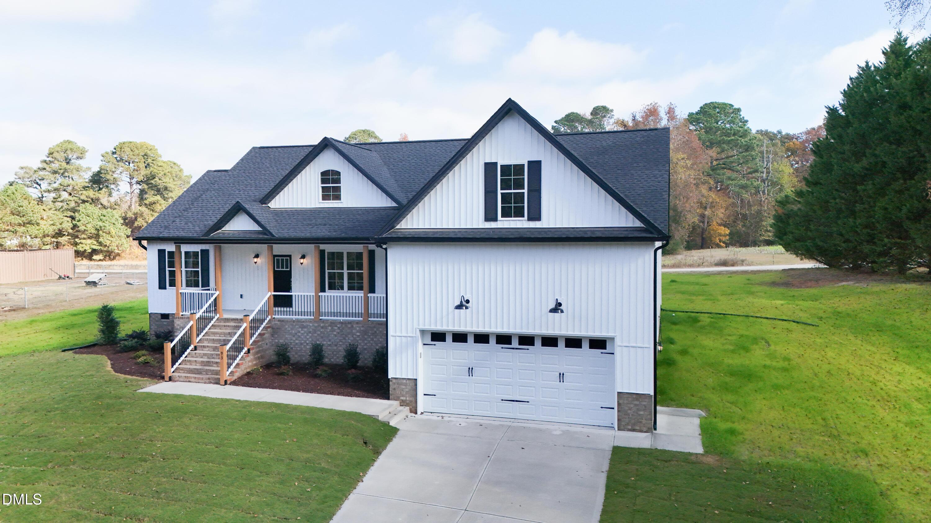 93 Big J Street Erwin, NC 28339 - Photo 5 of 56 a front view of a house with garden