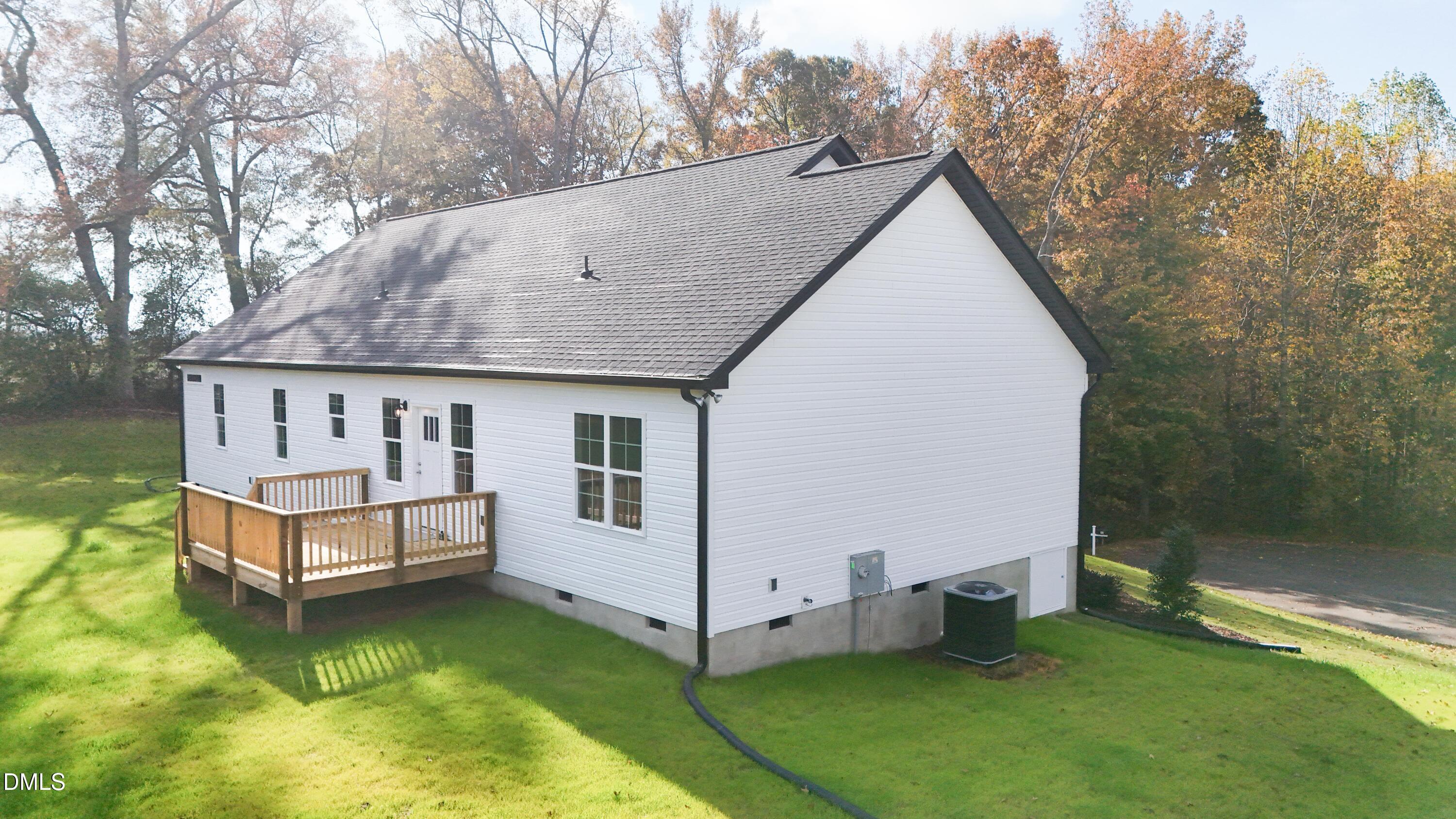 93 Big J Street Erwin, NC 28339 - Photo 6 of 56 a view of a house with a yard