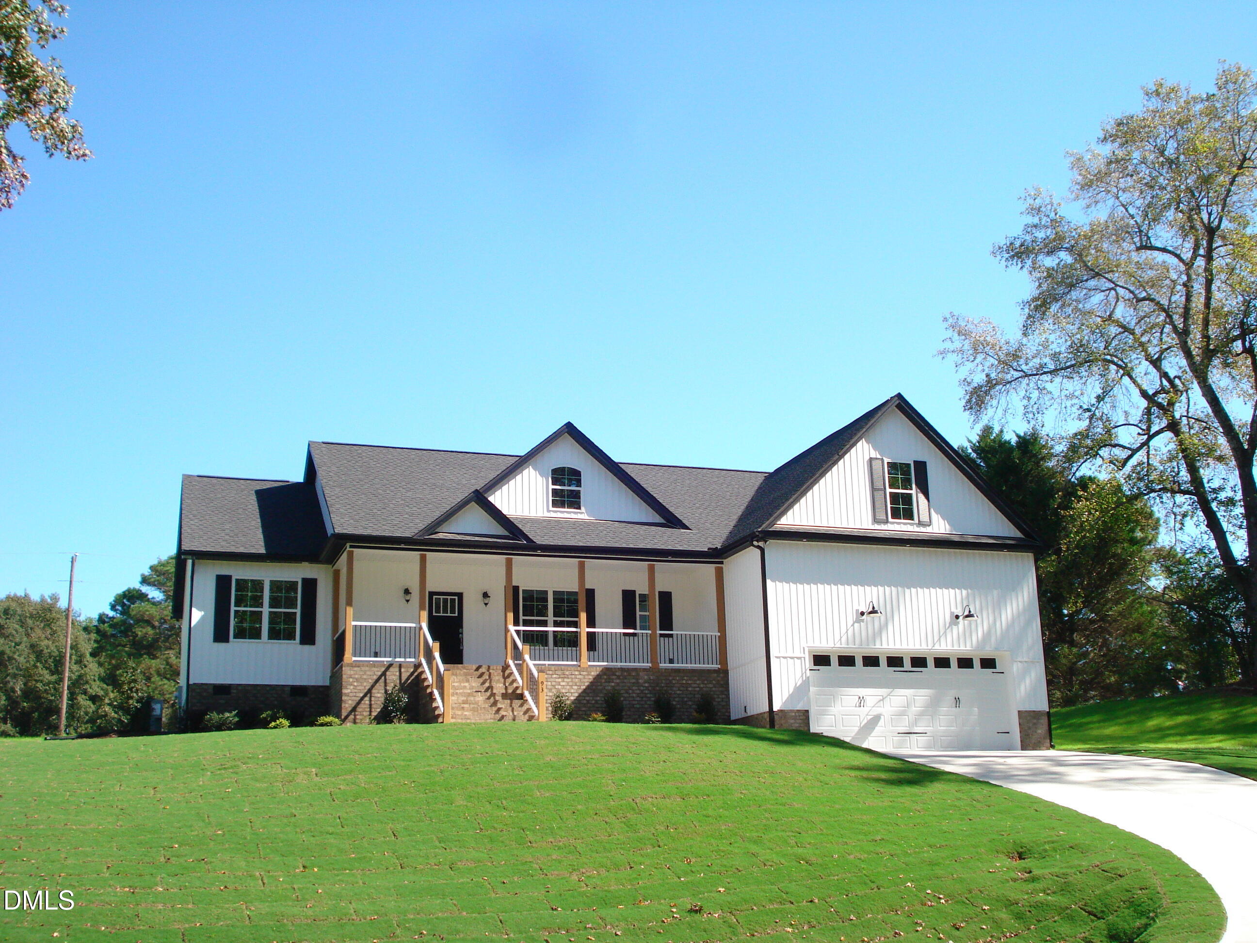93 Big J Street Erwin, NC 28339 - Photo 8 of 56 a front view of a house with a yard