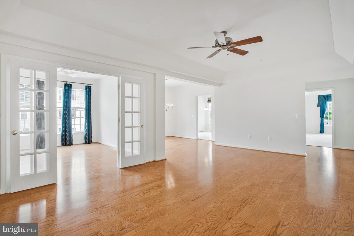 7315 Brookview Road, Unit 302 Elkridge, MD 21075 - Photo 10 of 68 a view of an empty room with wooden floor and a window
