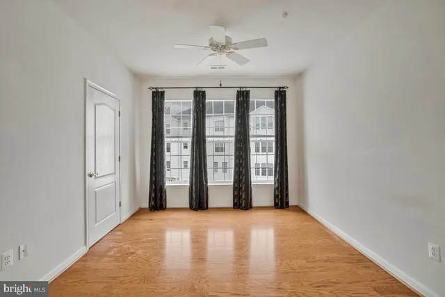 a view of a kitchen with stainless steel appliances granite countertop cabinets and a chandelier