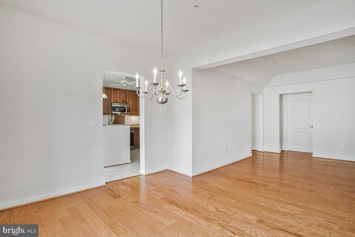 7315 Brookview Road, Unit 302 Elkridge, MD 21075 - Photo 19 of 68 wooden floor in an empty room with a window
