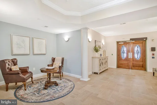a view of a room with wooden floor and bathroom