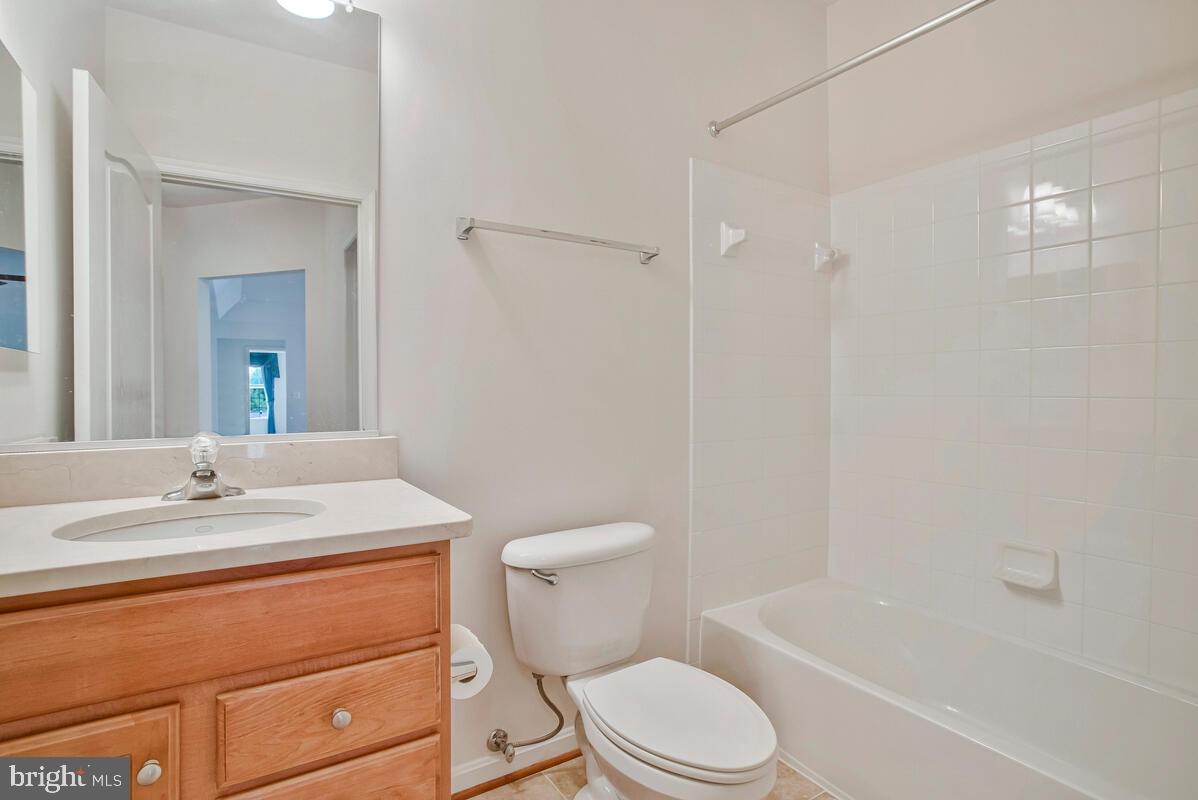 7315 Brookview Road, Unit 302 Elkridge, MD 21075 - Photo 35 of 68 a bathroom with a sink a toilet and shower