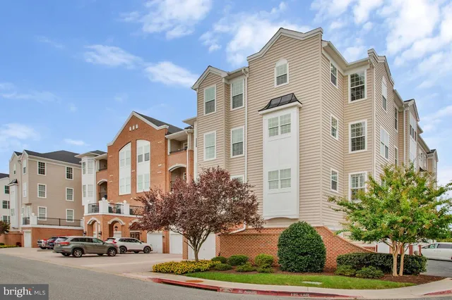 a view of a patio with a table and chairs
