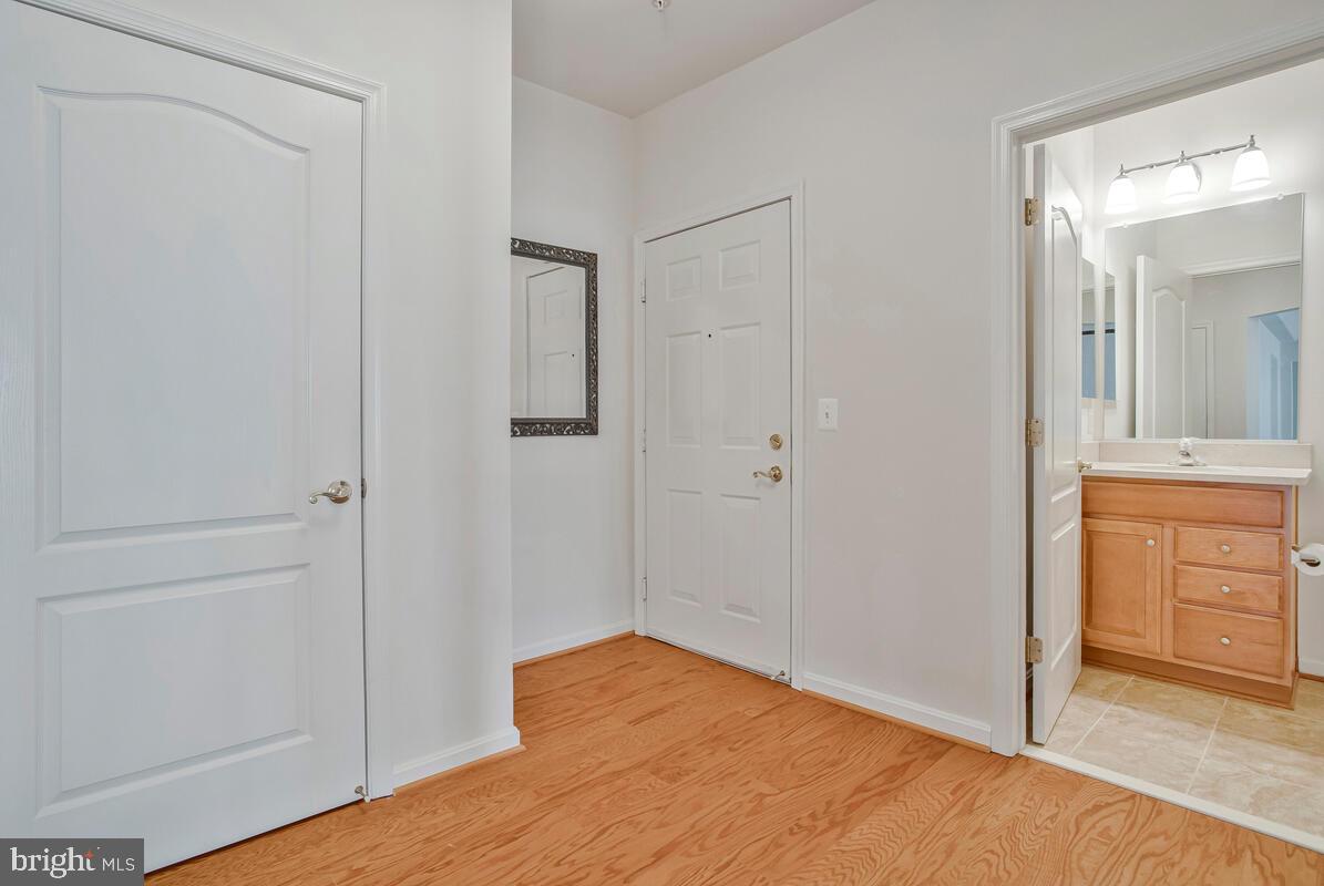 7315 Brookview Road, Unit 302 Elkridge, MD 21075 - Photo 8 of 68 a view of bathroom with a sink mirror and shower