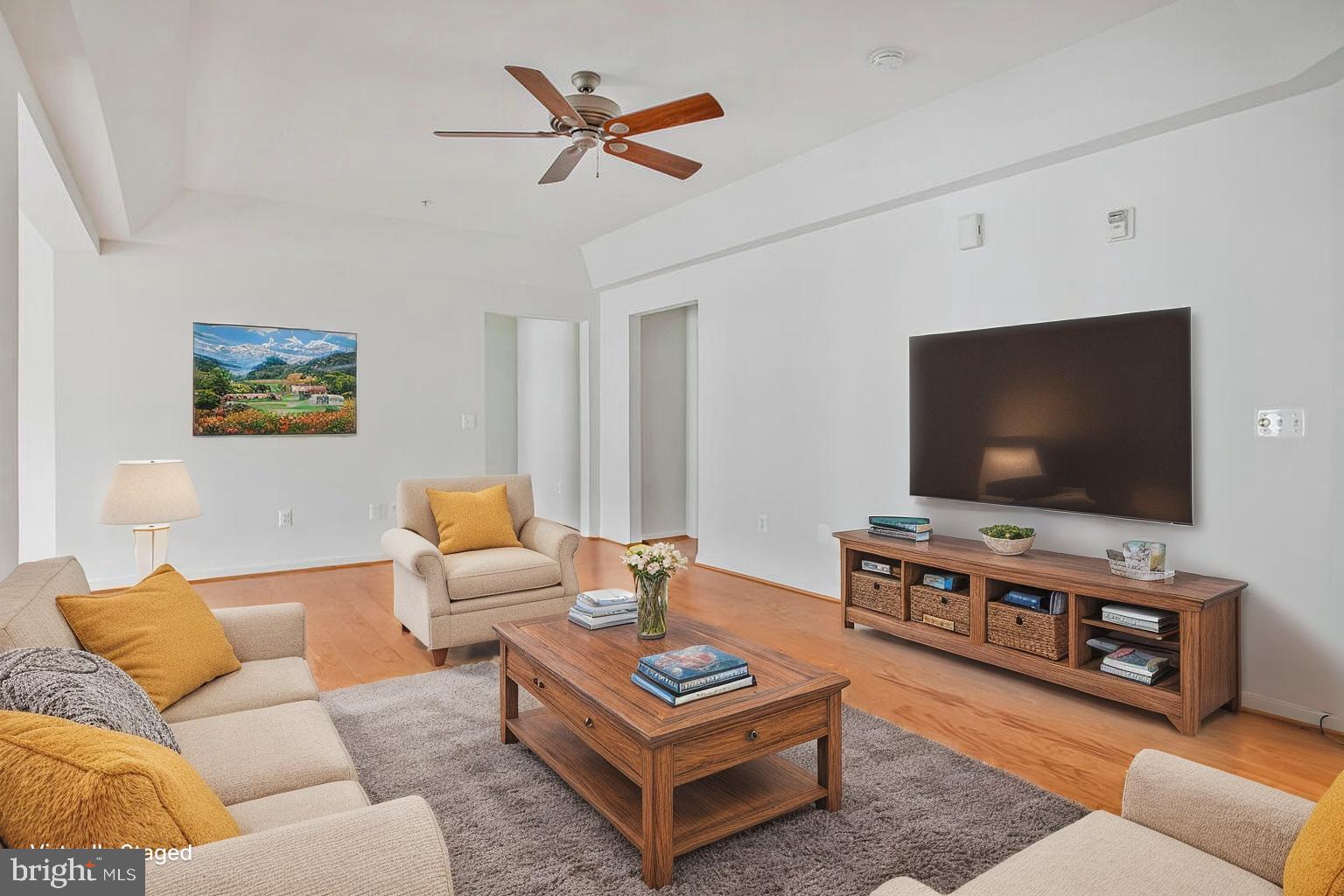 7315 Brookview Road, Unit 302 Elkridge, MD 21075 - Photo 9 of 68 a living room with furniture and a flat screen tv