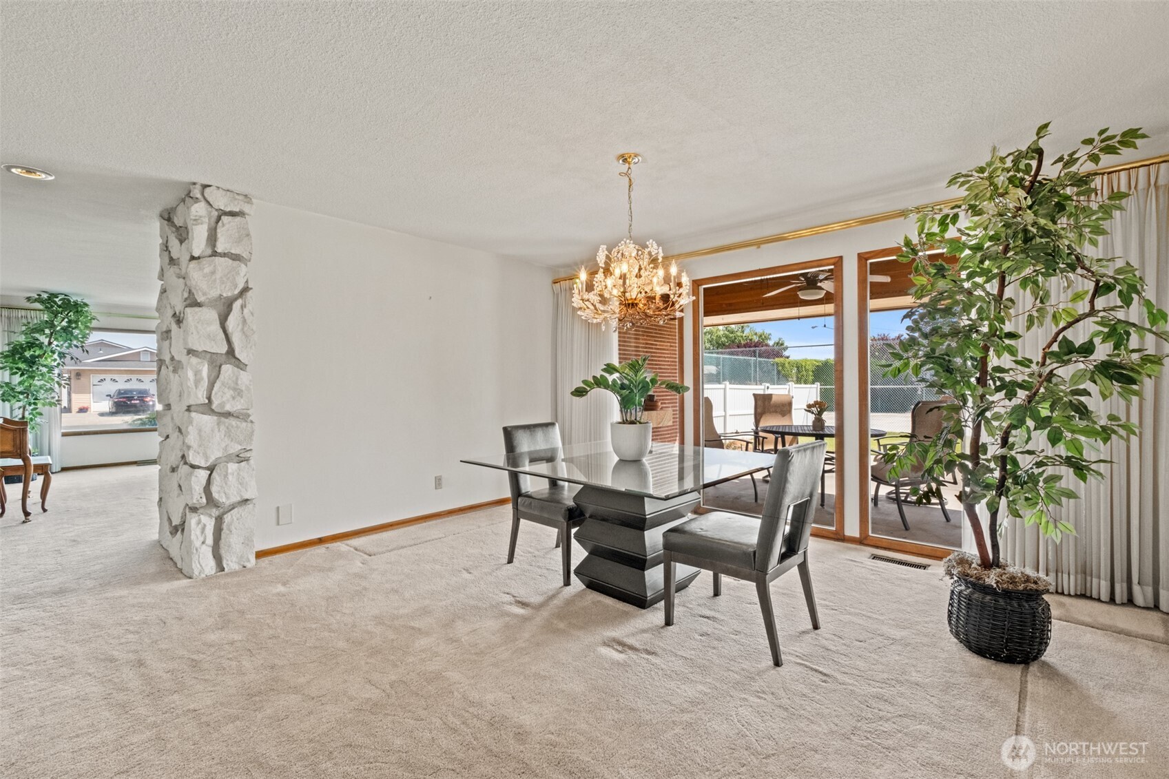 742 I Street Southwest Quincy, WA 98848 - Photo 7 of 28 a view of a dining room with furniture and chandelier