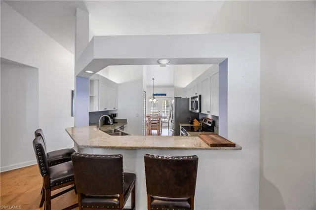 a kitchen with a table and chairs in it
