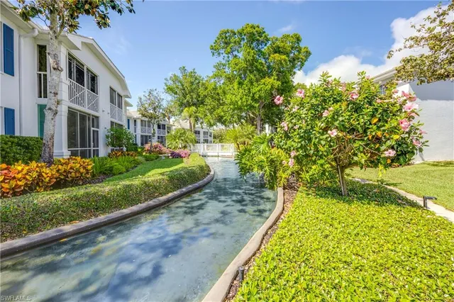 a view of a garden with a house