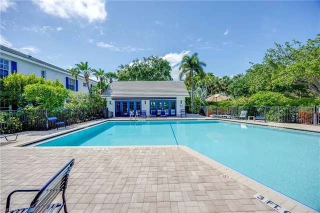 a view of house with outdoor space and swimming pool
