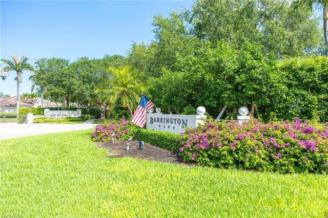 a view of a garden with flowers and trees