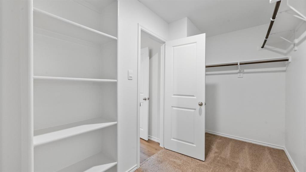 210 Pheasant Run Road Terrell, TX 75160 - Photo 18 of 28 a view of an empty walk in closet
