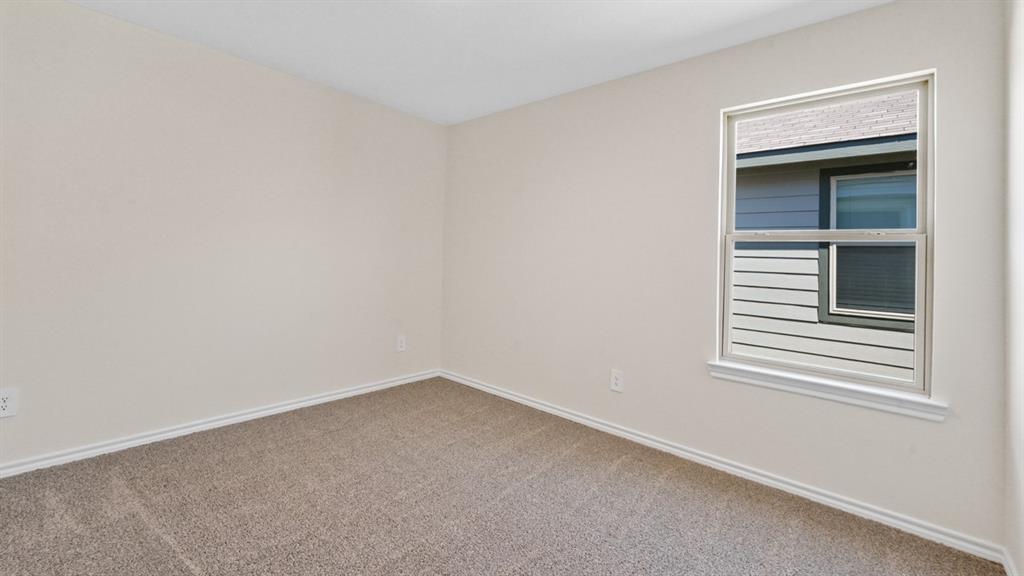 210 Pheasant Run Road Terrell, TX 75160 - Photo 21 of 28 an empty room with a window