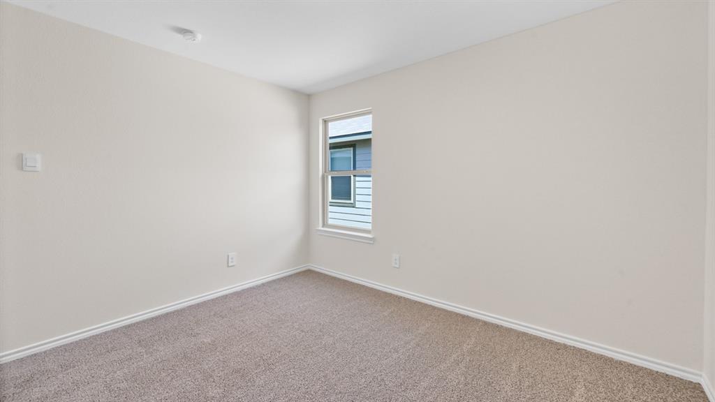 210 Pheasant Run Road Terrell, TX 75160 - Photo 26 of 28 a view of an empty room with a window