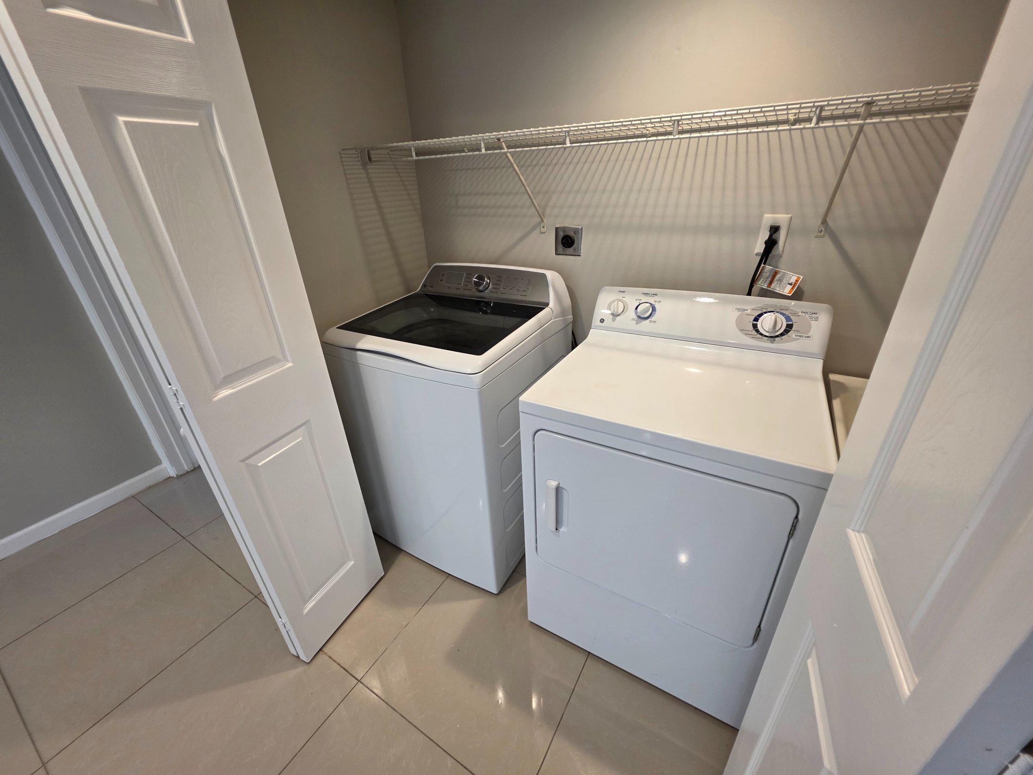 5915 Charnwood Road Catonsville, MD 21228 - Photo 18 of 21 Lower Level laundry space with sleek appliances.