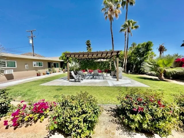 a view of a swimming pool with an outdoor space and seating area