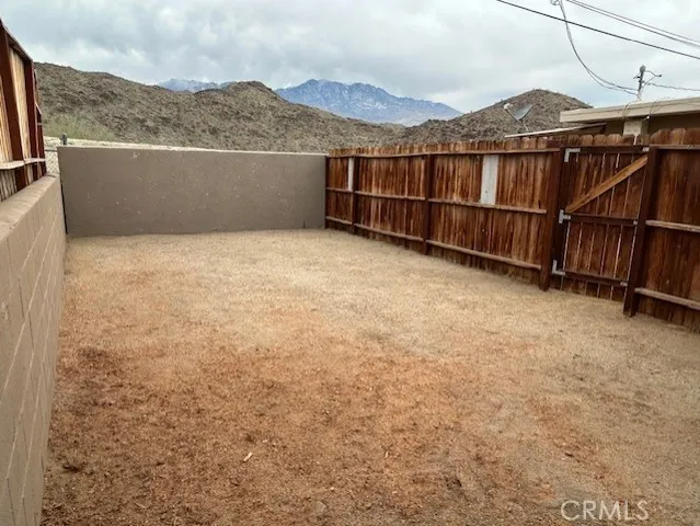 a view of a terrace with a yard