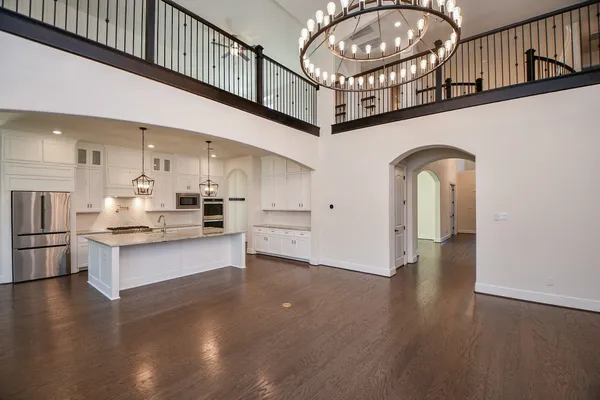 a view of a hallway with kitchen