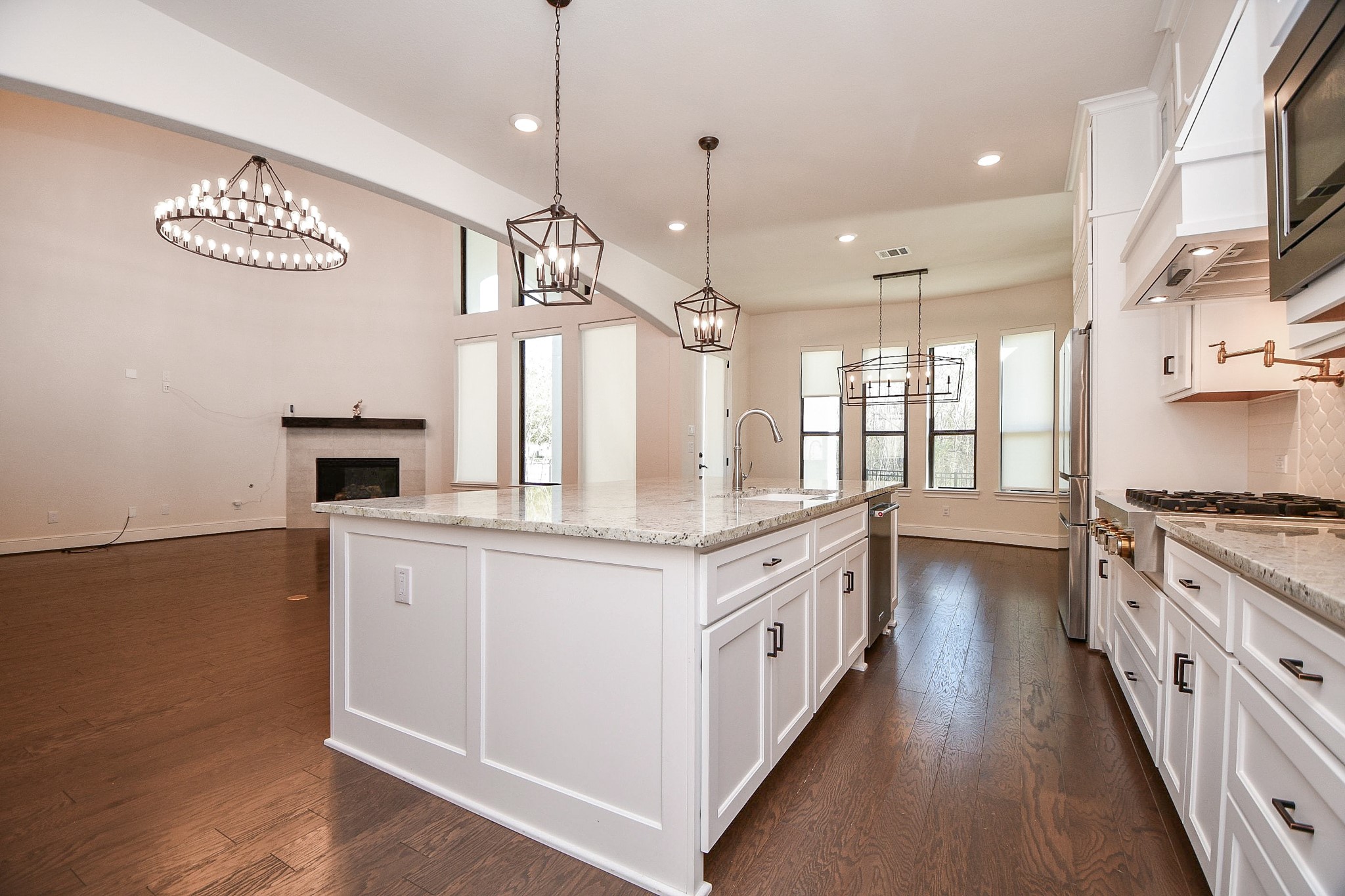 8526 Tombron Grove Road Magnolia, TX 77354 - Photo 14 of 50 a kitchen with stainless steel appliances granite countertop a stove and a sink