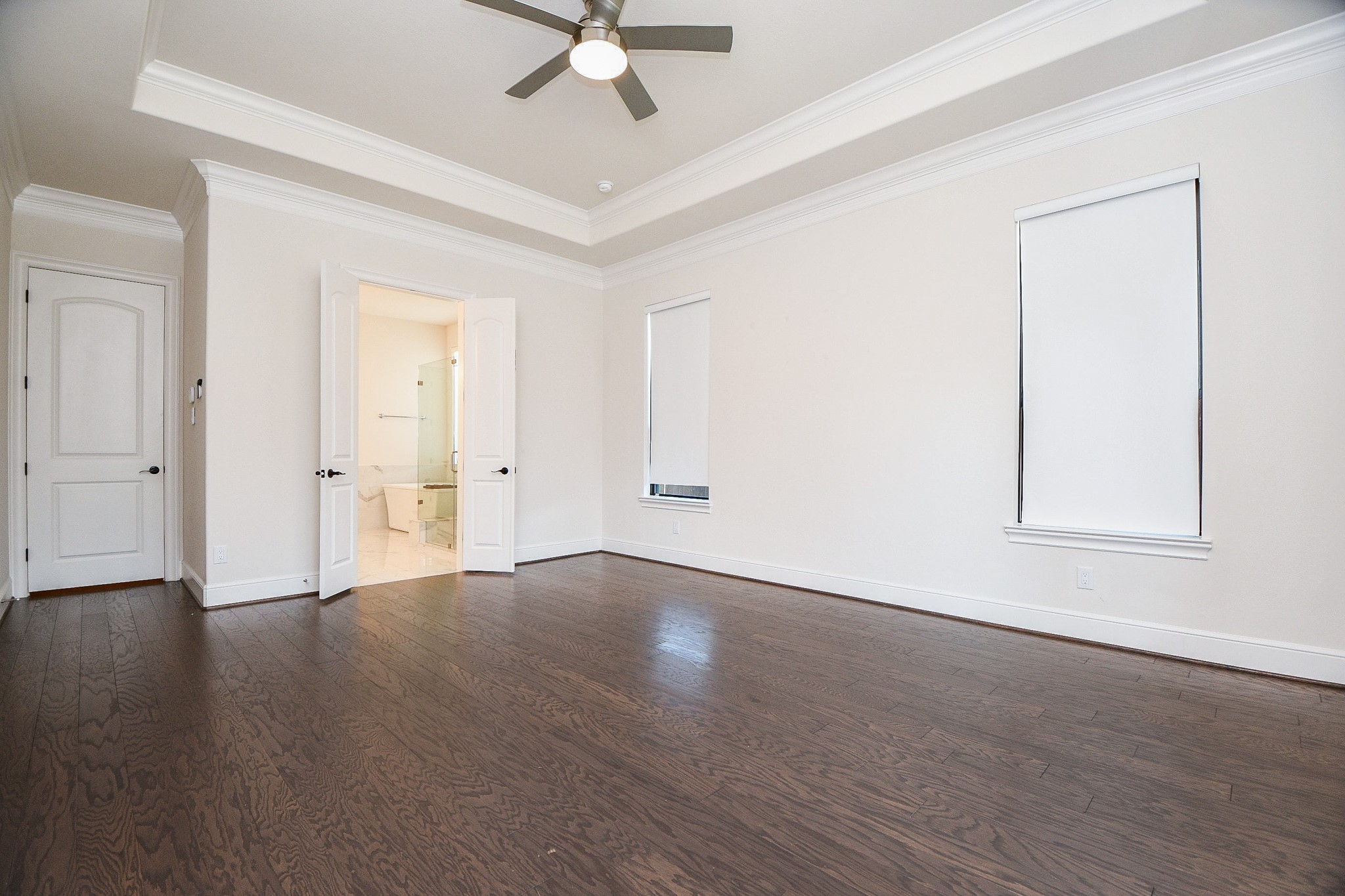 8526 Tombron Grove Road Magnolia, TX 77354 - Photo 18 of 50 an empty room with wooden floor and ceiling fan