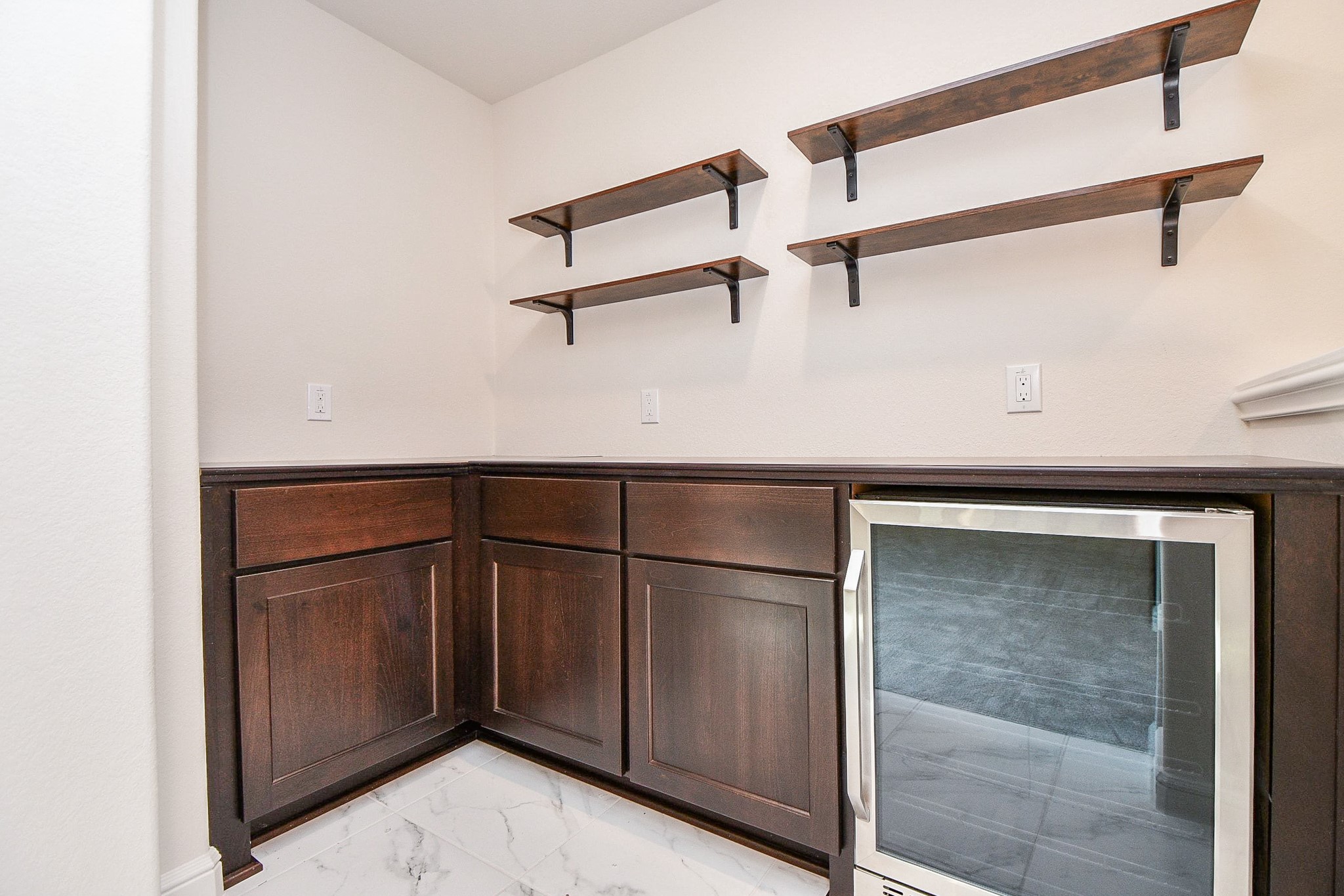 8526 Tombron Grove Road Magnolia, TX 77354 - Photo 25 of 50 a kitchen with a refrigerator and cabinets