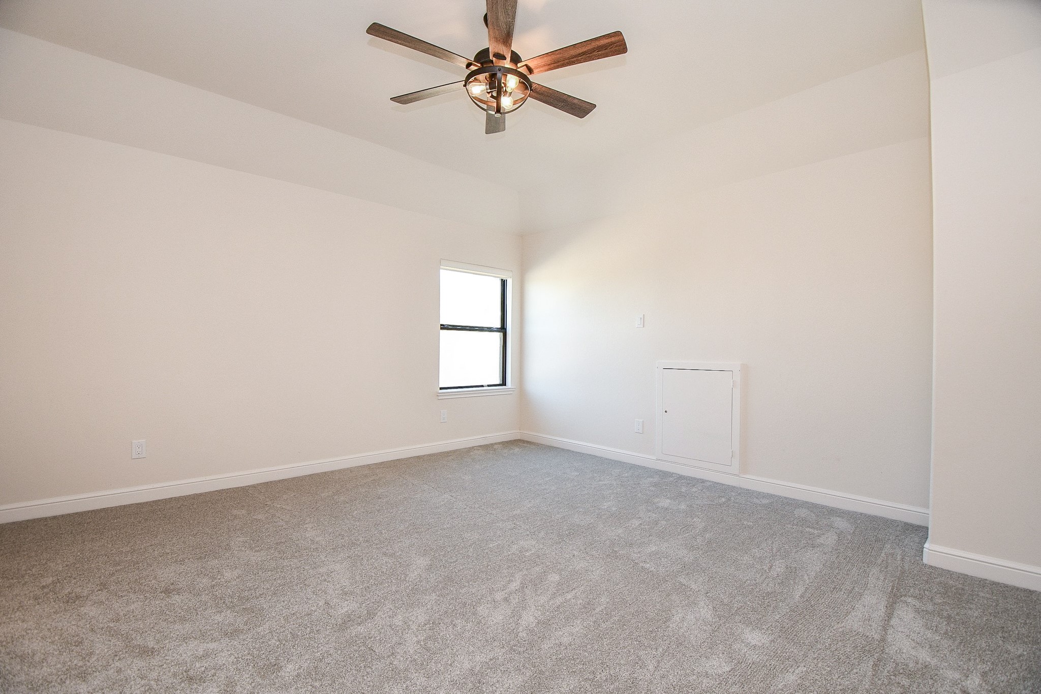 8526 Tombron Grove Road Magnolia, TX 77354 - Photo 29 of 50 an empty room with windows and fan