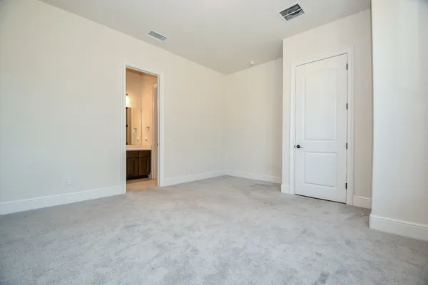 an empty room with closet area