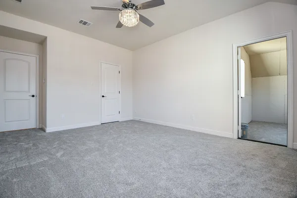 an empty room with a bathroom