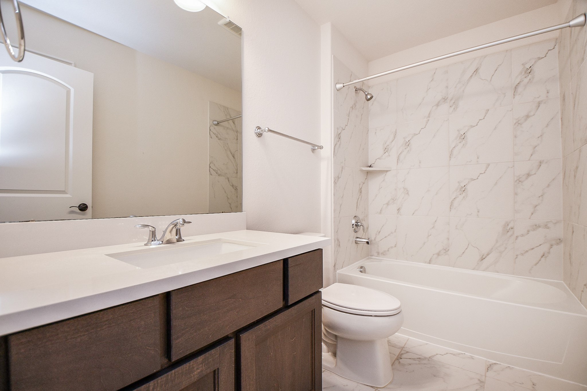 8526 Tombron Grove Road Magnolia, TX 77354 - Photo 41 of 50 a bathroom with a sink a toilet and shower