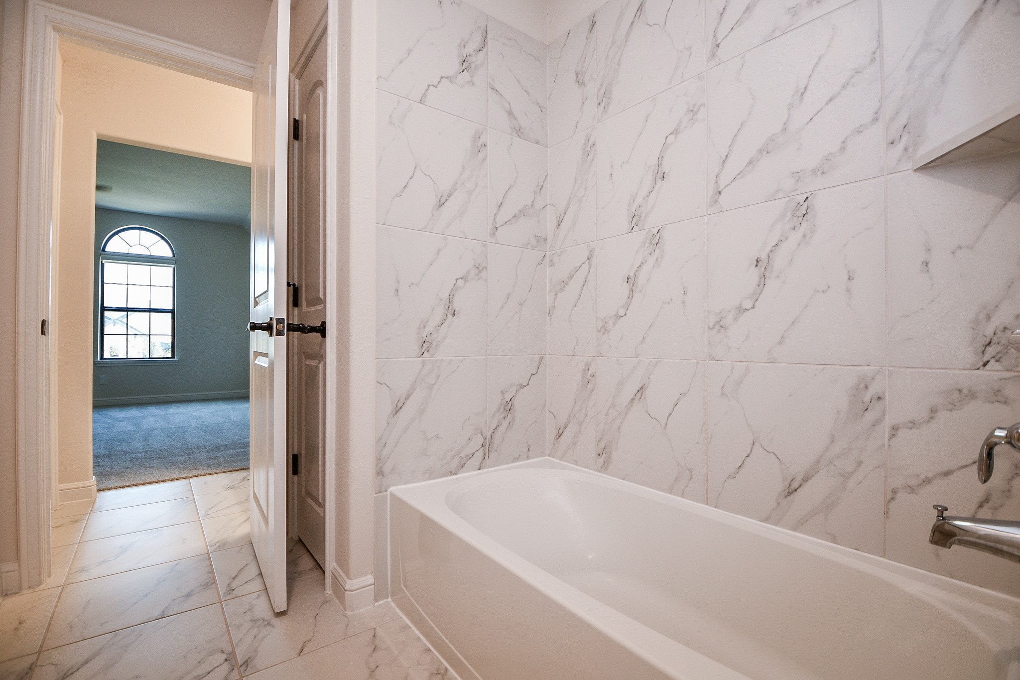 8526 Tombron Grove Road Magnolia, TX 77354 - Photo 43 of 50 a bathroom with a bathtub and a shower