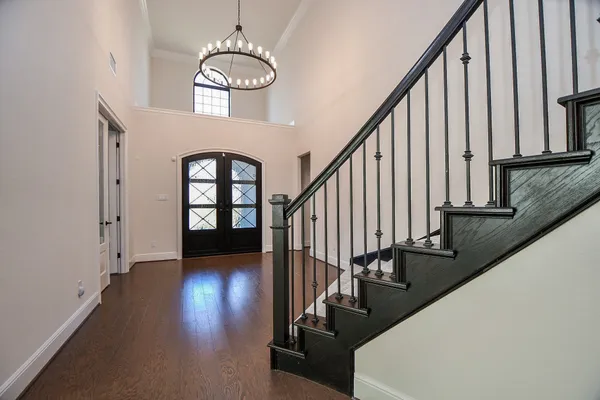 a view of staircase with wooden floor and a window