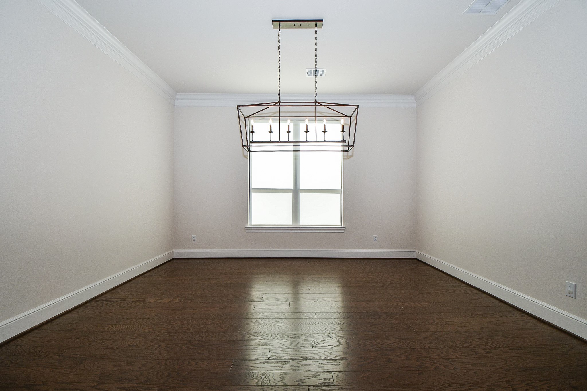 8526 Tombron Grove Road Magnolia, TX 77354 - Photo 7 of 50 an empty room with wooden floor and windows