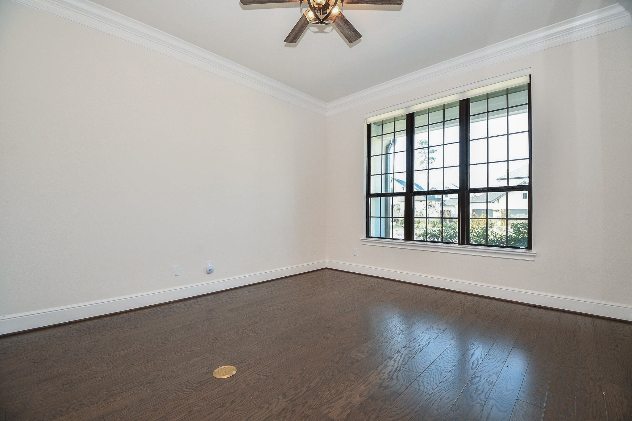 8526 Tombron Grove Road Magnolia, TX 77354 - Photo 9 of 50 an empty room with a window and a ceiling fan