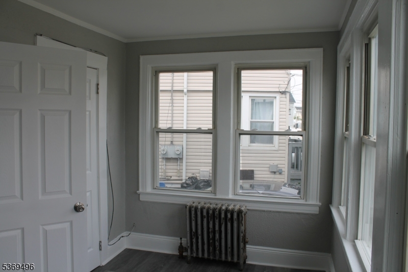 67 Edgar Street, Unit 1 Carteret, NJ 07008 - Photo 11 of 11 a view of a room that has a window in it