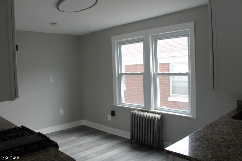 67 Edgar Street, Unit 1 Carteret, NJ 07008 - Photo 6 of 11 a view of an empty room with a window