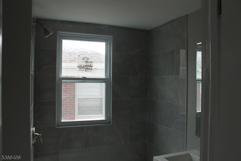 67 Edgar Street, Unit 1 Carteret, NJ 07008 - Photo 7 of 11 a bathroom with a window