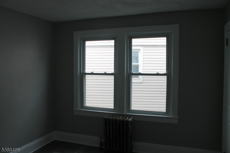 67 Edgar Street, Unit 1 Carteret, NJ 07008 - Photo 9 of 11 a view of a window in an empty room