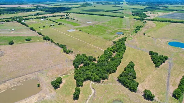 a view of a swimming pool with a yard