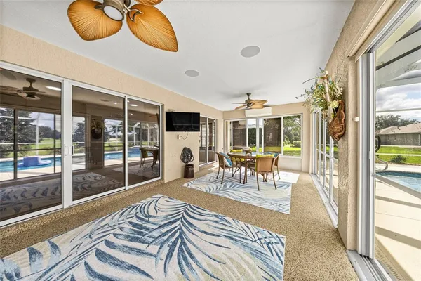 a view of swimming pool with seating area
