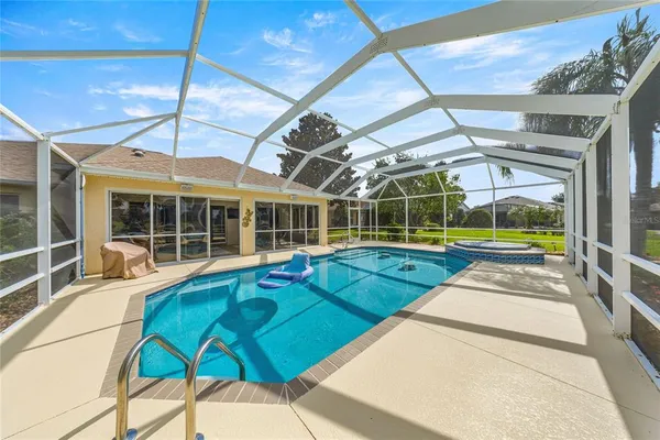 a view of a house with swimming pool